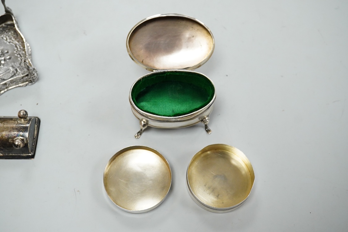 A George V silver mounted oval trinket box, Clark & Sewell, Chester, 1924, 65mm, together with a small silver circular pill box and cover, a 925 double stamp box, and a late Victorian continental silver miniature model o
